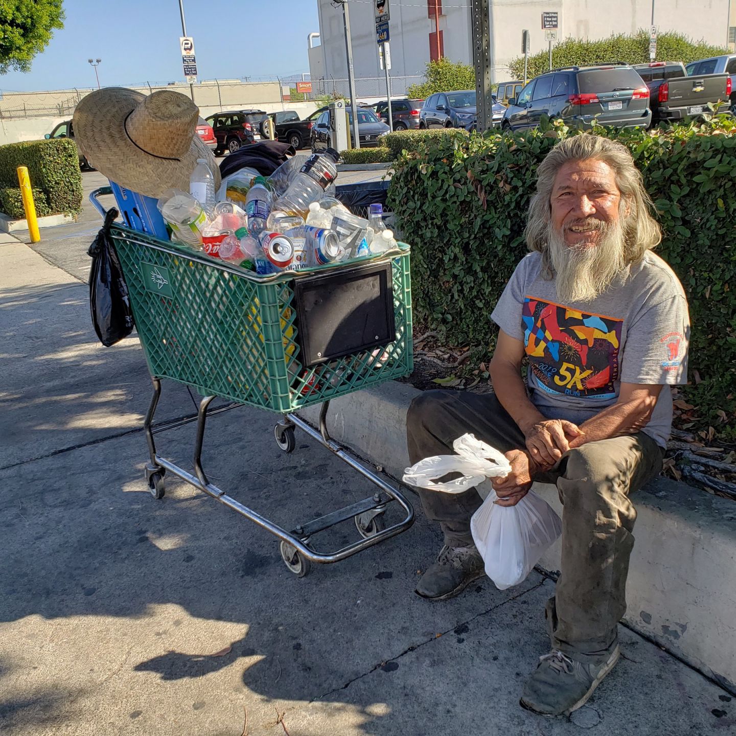 Portrait of Jaime Sosa as he smiles and thanks a volunteer for the food (Amairani Hernandez_UT).j.jpg